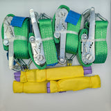 Set of green straps with metal clips on a white background